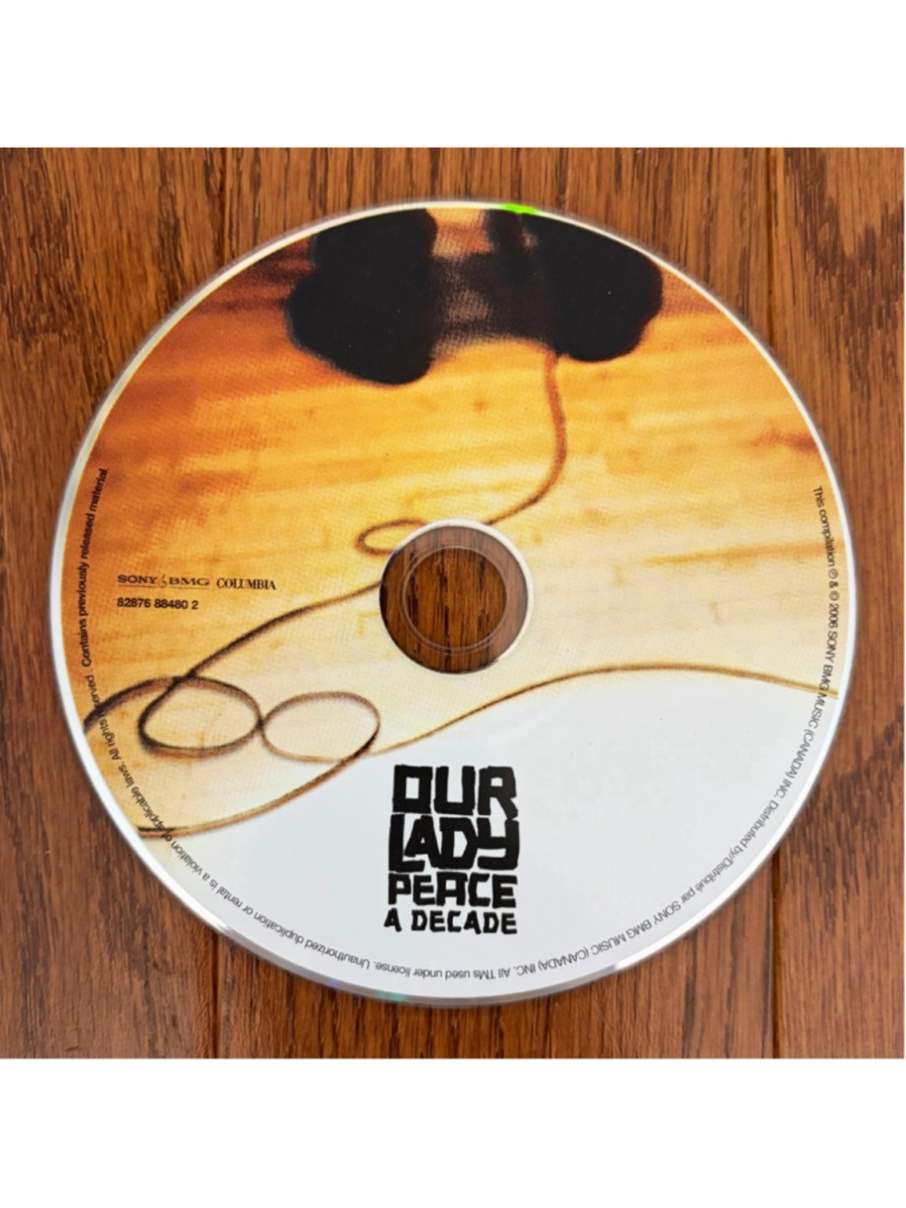 Our Lady Peace A Decade CD Album Orange and Black One Size